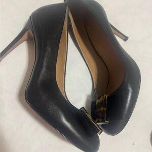 Tory Burch Black Leather Stiletto Pumps with Gold-Tone Logo Accent